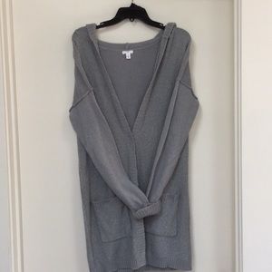 Mid length hooded gray sweater.